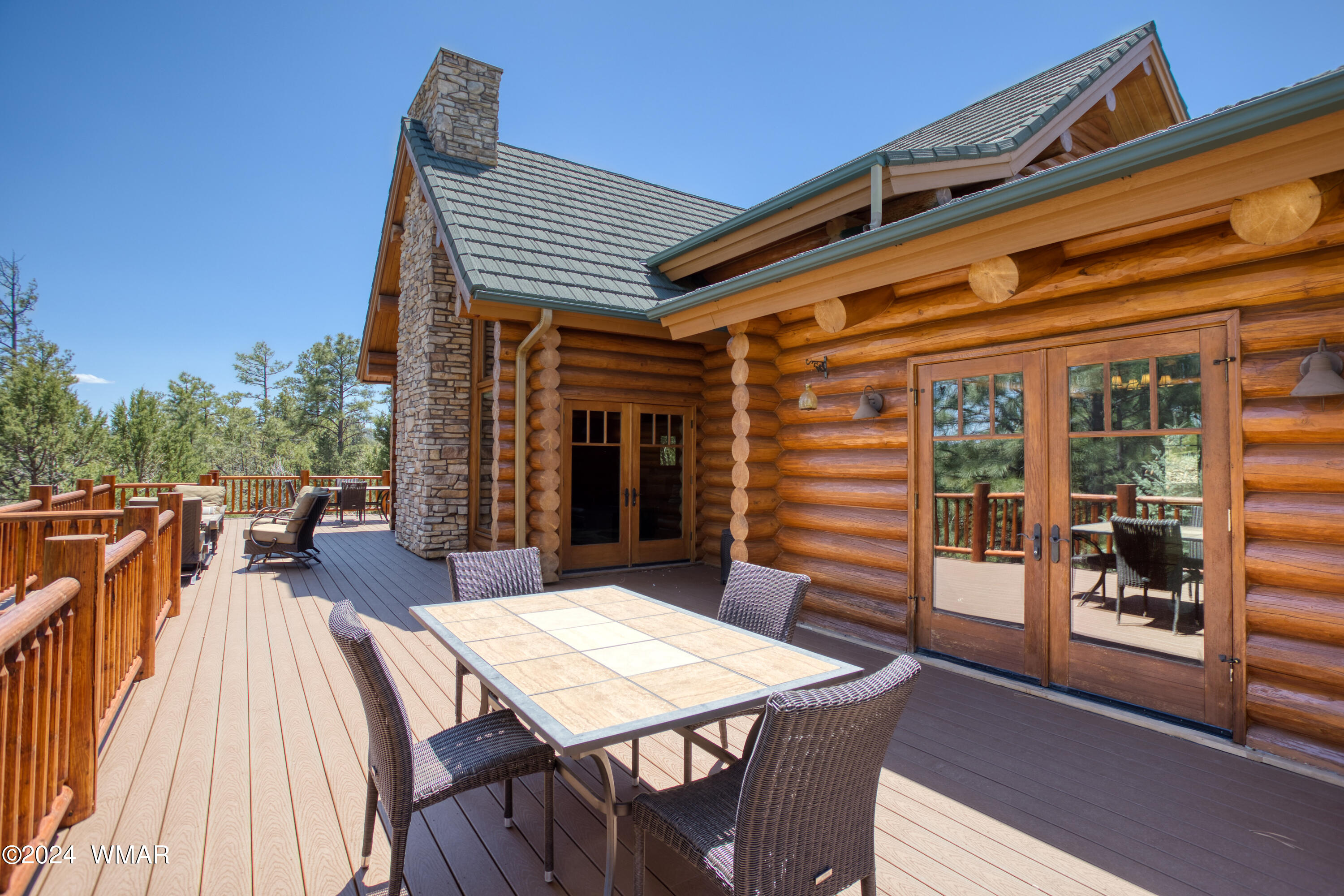 4281 Shaggy Bark Road Show Low, AZ 85901 - Photo 10 of 84 a view of a patio with table and chairs with wooden floor and fence