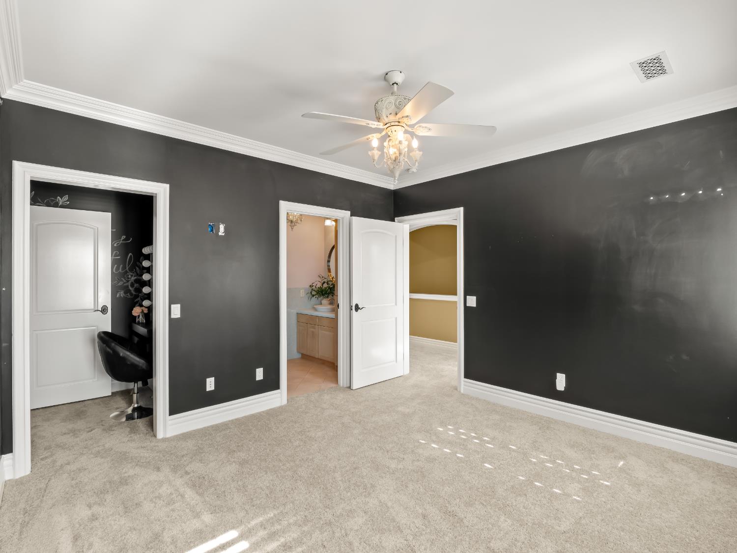 17113 Mark Road Madera, CA 93636 - Photo 45 of 99 an empty room with closet and a chandelier fan