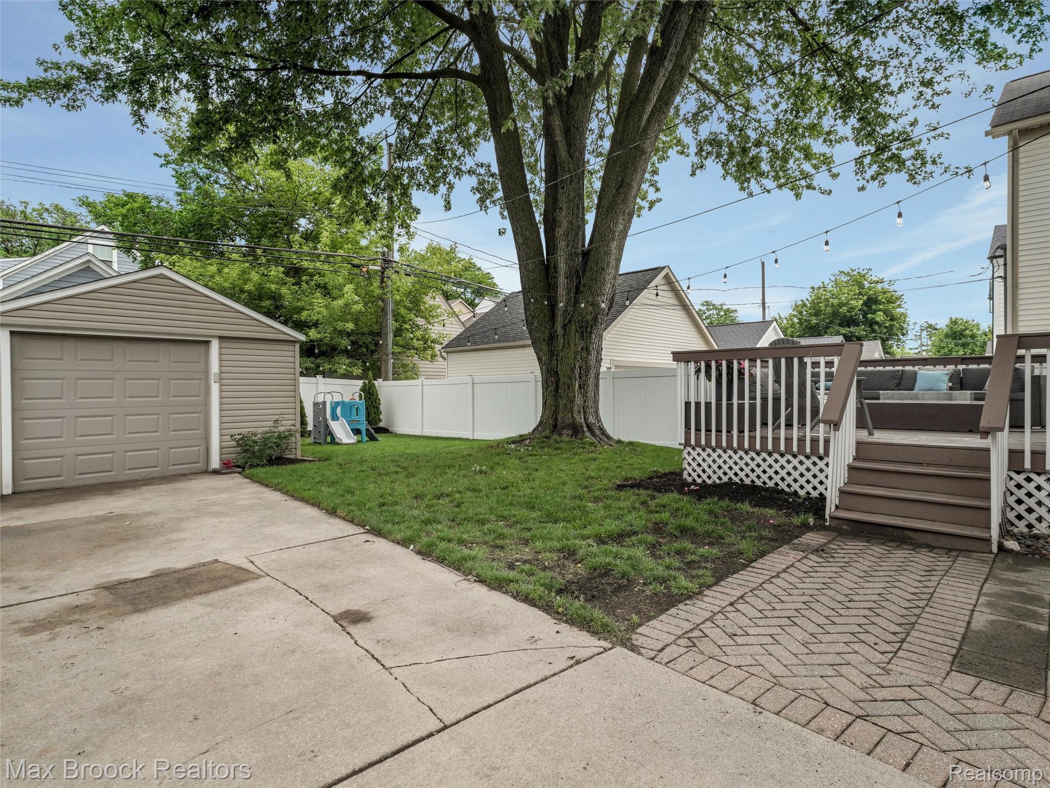 1201 Cole Street Birmingham, MI 48009 - Photo 28 of 35 View of garage, deck, and backyard
