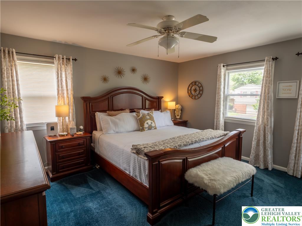 2087 Hopewell Road Bethlehem, PA 18017 - Photo 23 of 38 Relax in this well-appointed bedroom featuring a comfortable bed and ample natural light from multiple windows.
