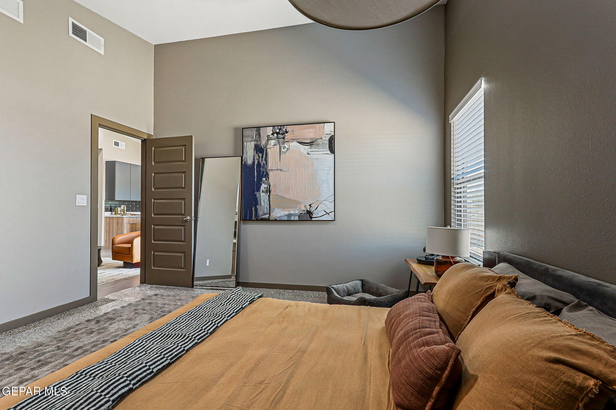 8421 Phile Place Vinton, TX 79821 - Photo 18 of 31 a bed sitting in a bedroom next to a window