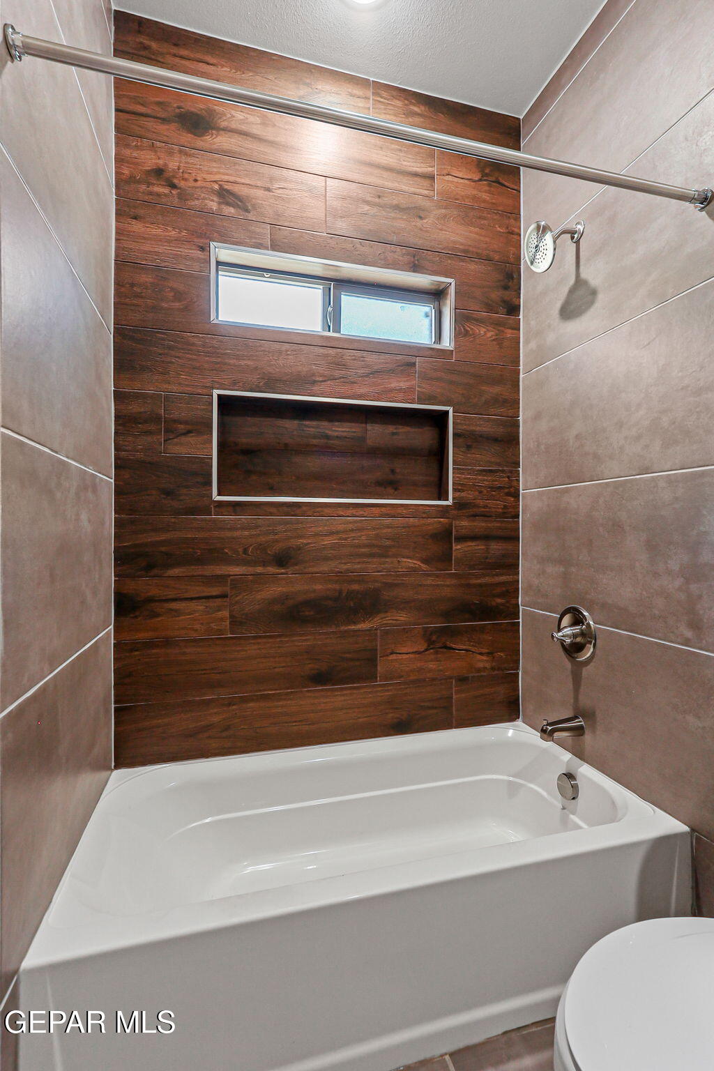 8421 Phile Place Vinton, TX 79821 - Photo 23 of 31 a bathroom with a toilet and a bathtub