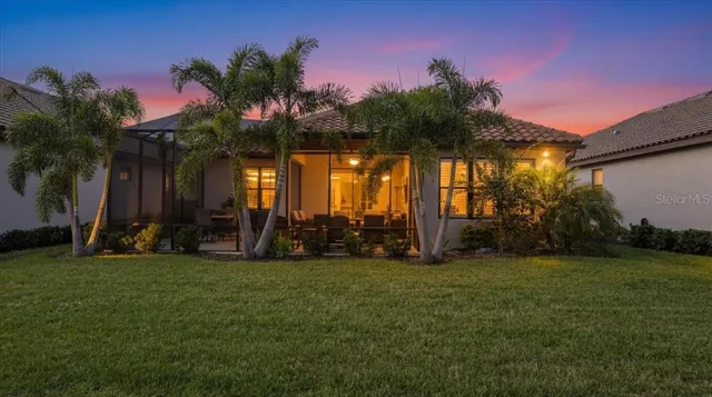 a swimming pool with outdoor seating and yard