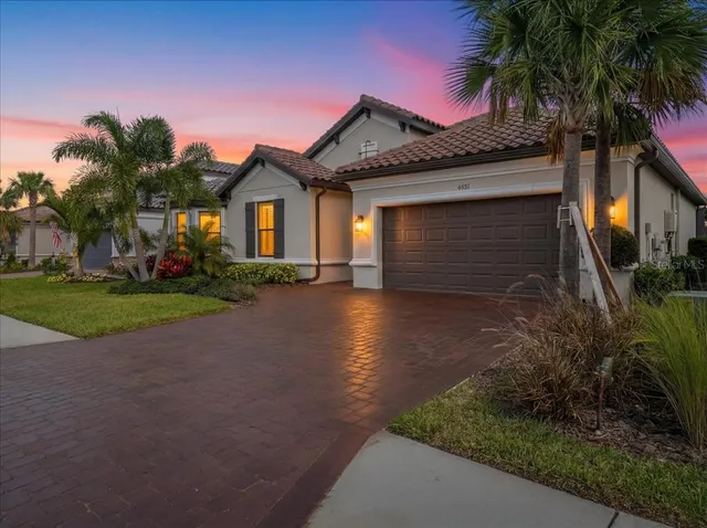 a view of a backyard with sitting area