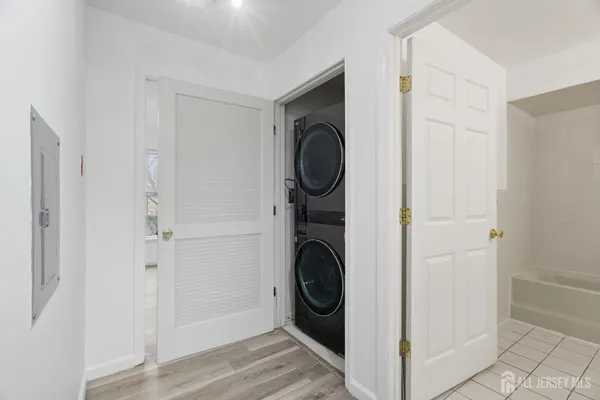 a view of a hallway with washer and dryer