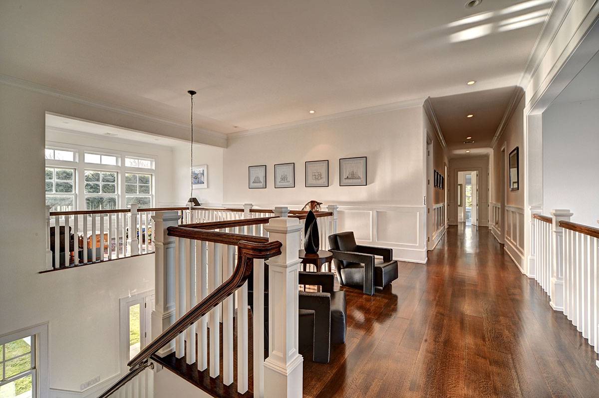 63 Newlight Lane Bridgehampton, NY 11976 - Photo 16 of 37 a view of a livingroom with furniture wooden floor and windows