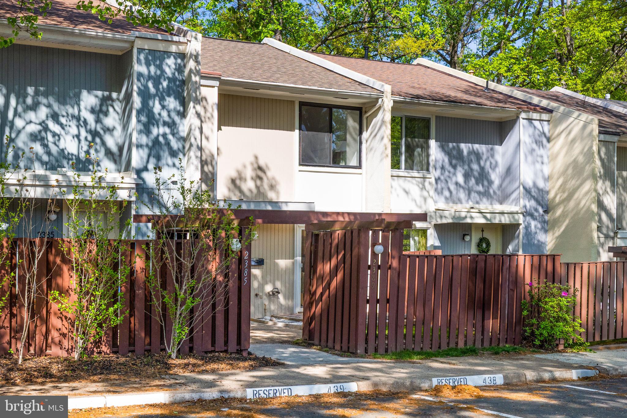 2389 Southgate Square Reston, VA 20191 - Photo 2 of 56 a front view of a house with a yard