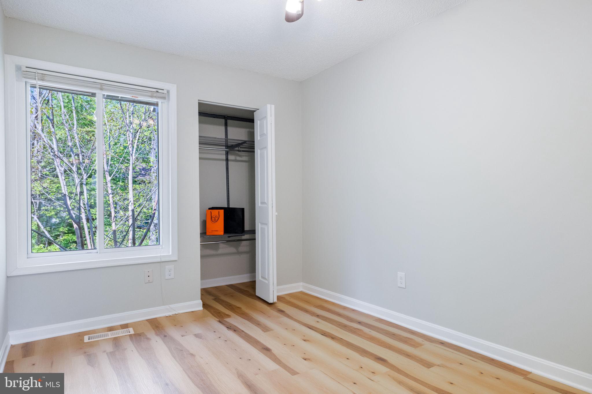 2389 Southgate Square Reston, VA 20191 - Photo 29 of 56 a view of an empty room with wooden floor and windows