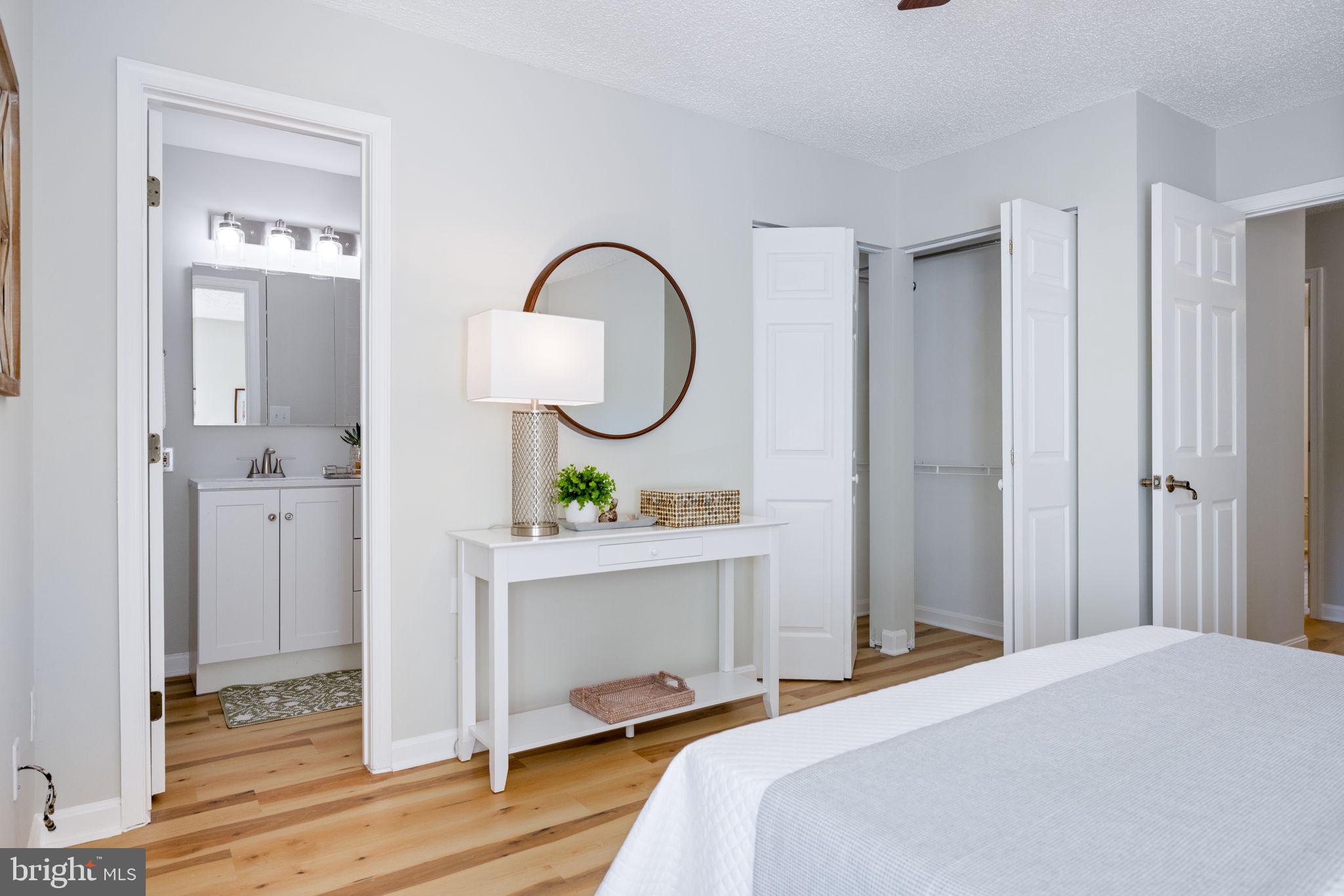 2389 Southgate Square Reston, VA 20191 - Photo 37 of 56 a bedroom with bed and a chandelier