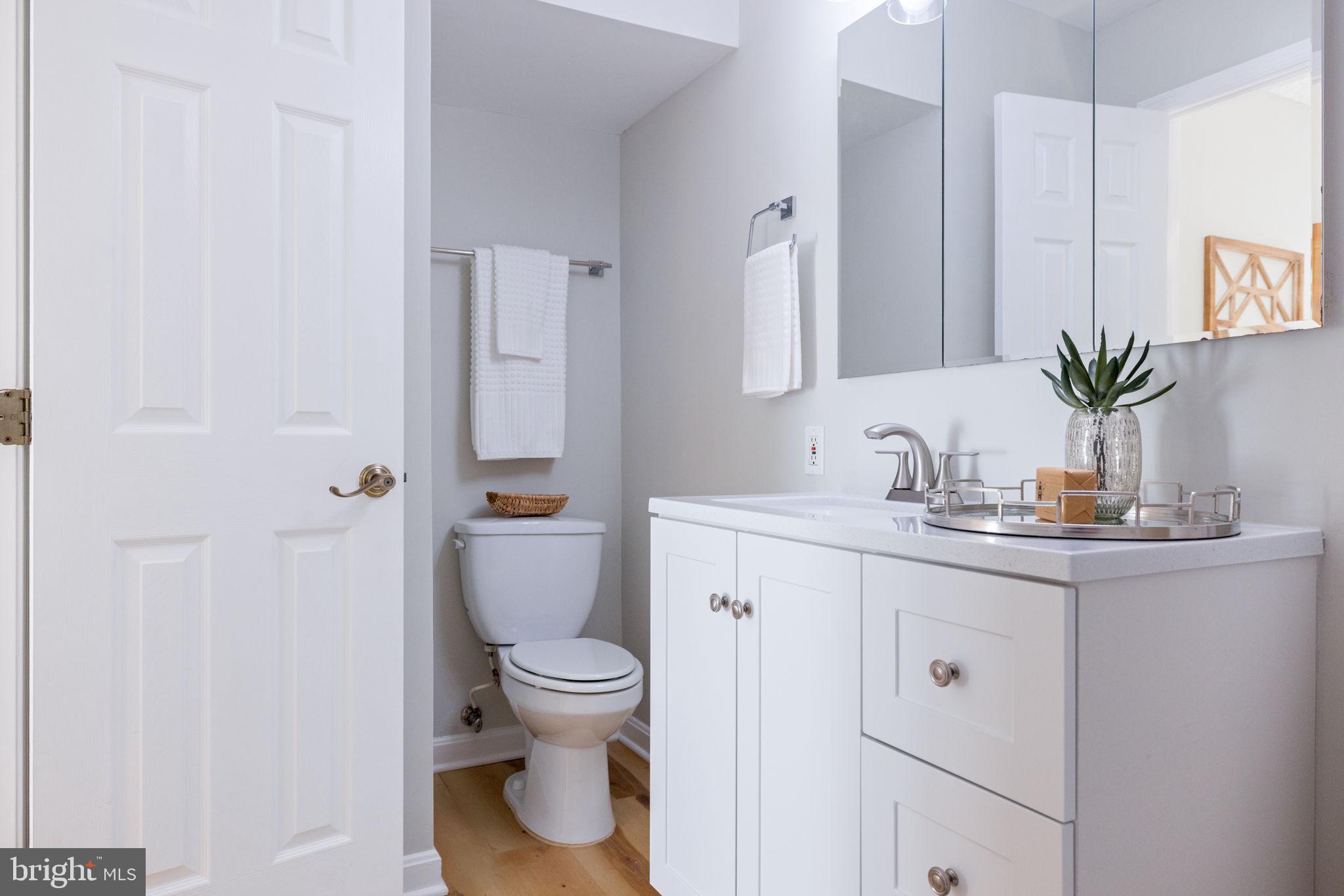 2389 Southgate Square Reston, VA 20191 - Photo 39 of 56 a bathroom with a granite countertop sink toilet and shower