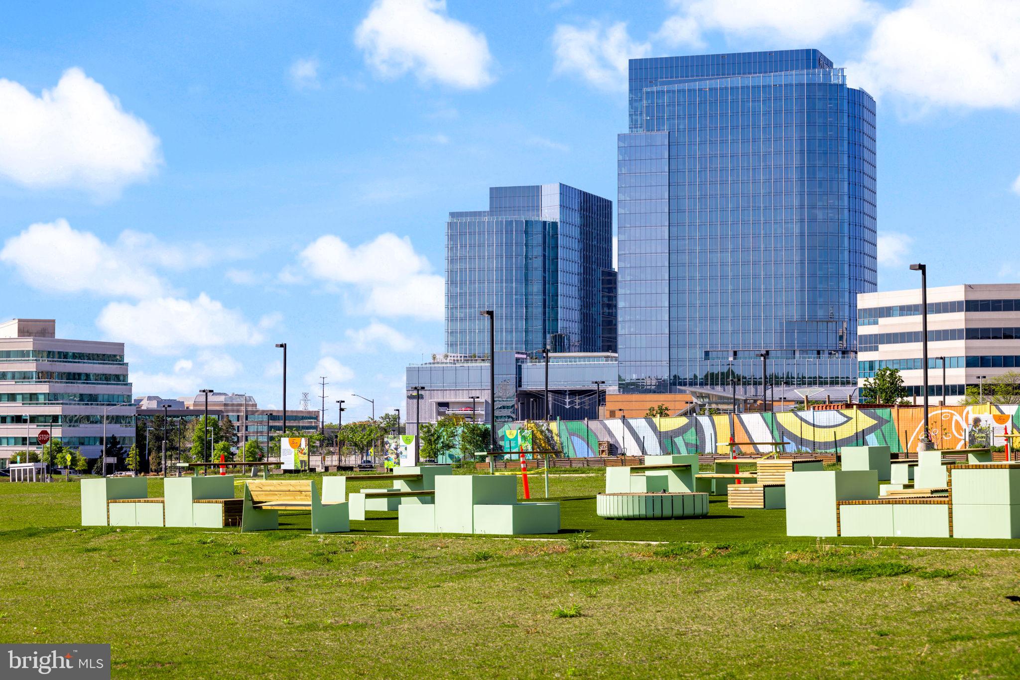 2389 Southgate Square Reston, VA 20191 - Photo 50 of 56 a view of swimming pool of a building with lawn chairs