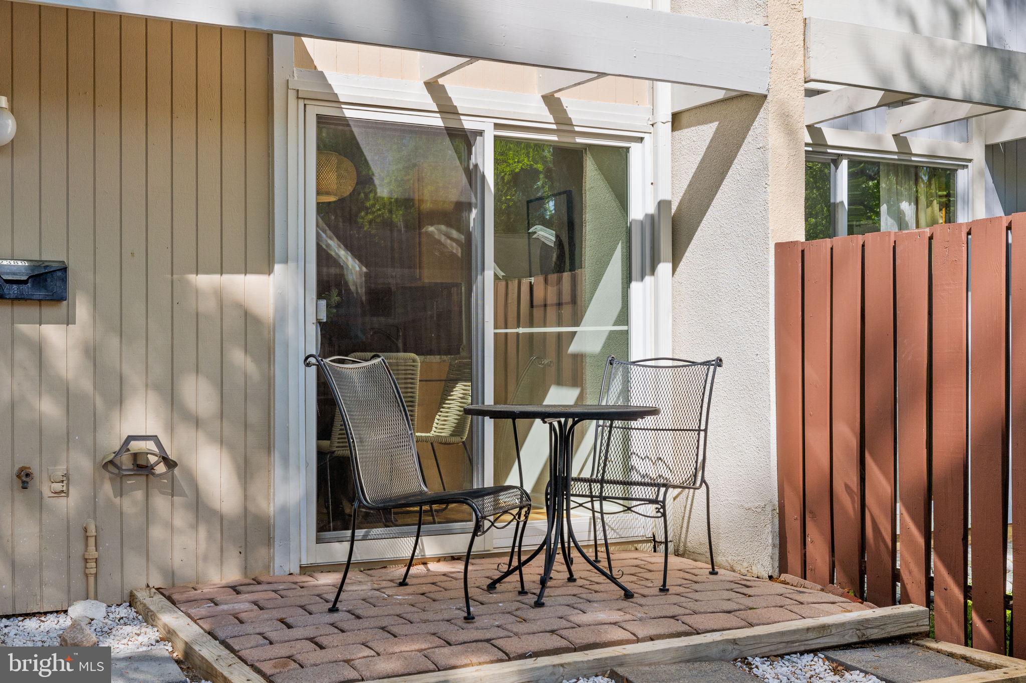2389 Southgate Square Reston, VA 20191 - Photo 5 of 56 a view of balcony with two chairs and a potted plant