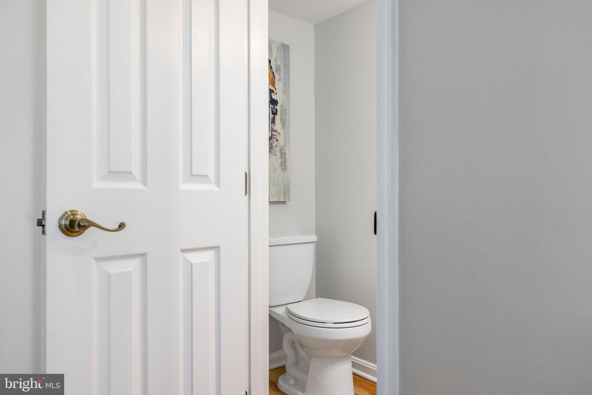 2389 Southgate Square Reston, VA 20191 - Photo 6 of 56 a bathroom with a toilet and a shower