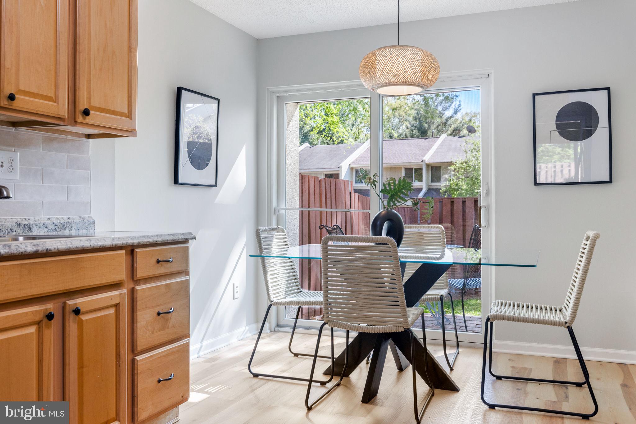 2389 Southgate Square Reston, VA 20191 - Photo 8 of 56 a dining room with furniture and window