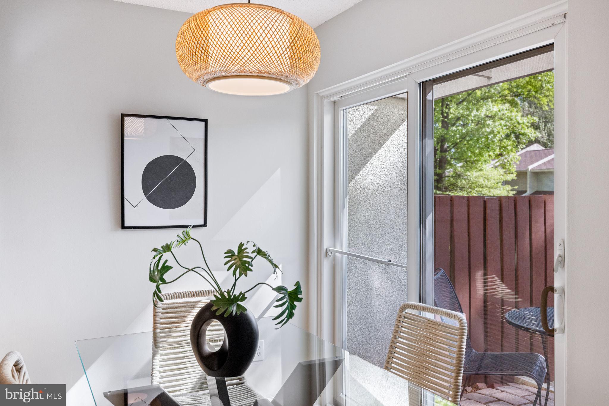 2389 Southgate Square Reston, VA 20191 - Photo 9 of 56 a vase of flowers sitting on a table near a window