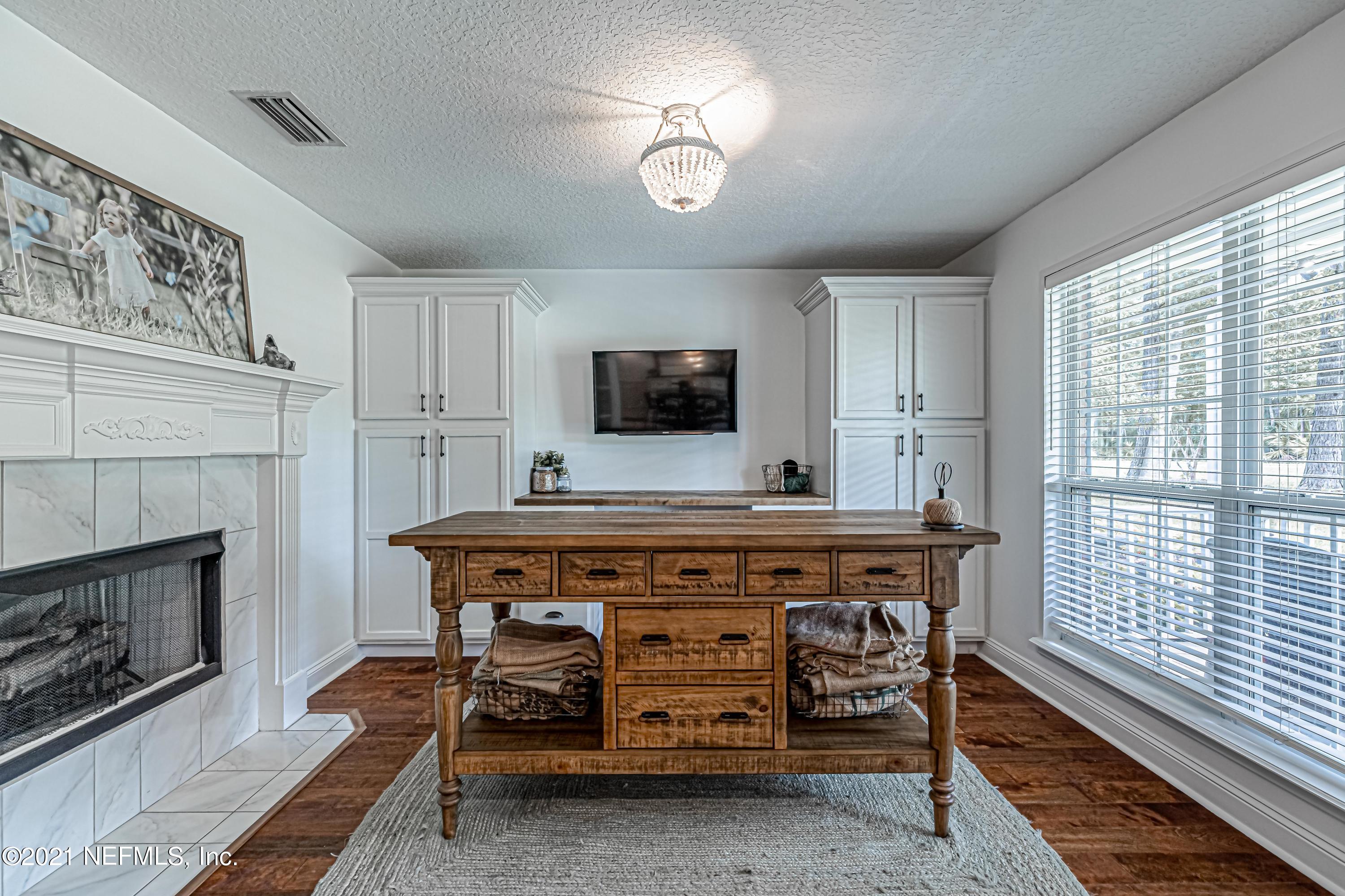 184 Circuit Rider Road Green Cove Springs, FL 32043 - Photo 13 of 58 a room with furniture and a fireplace