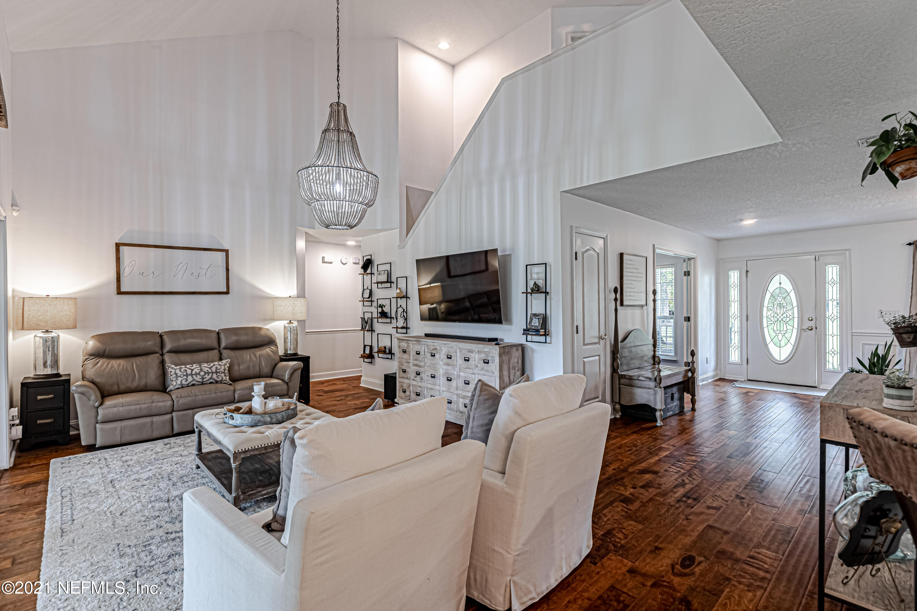 184 Circuit Rider Road Green Cove Springs, FL 32043 - Photo 18 of 58 a living room with furniture a flat screen tv and kitchen view
