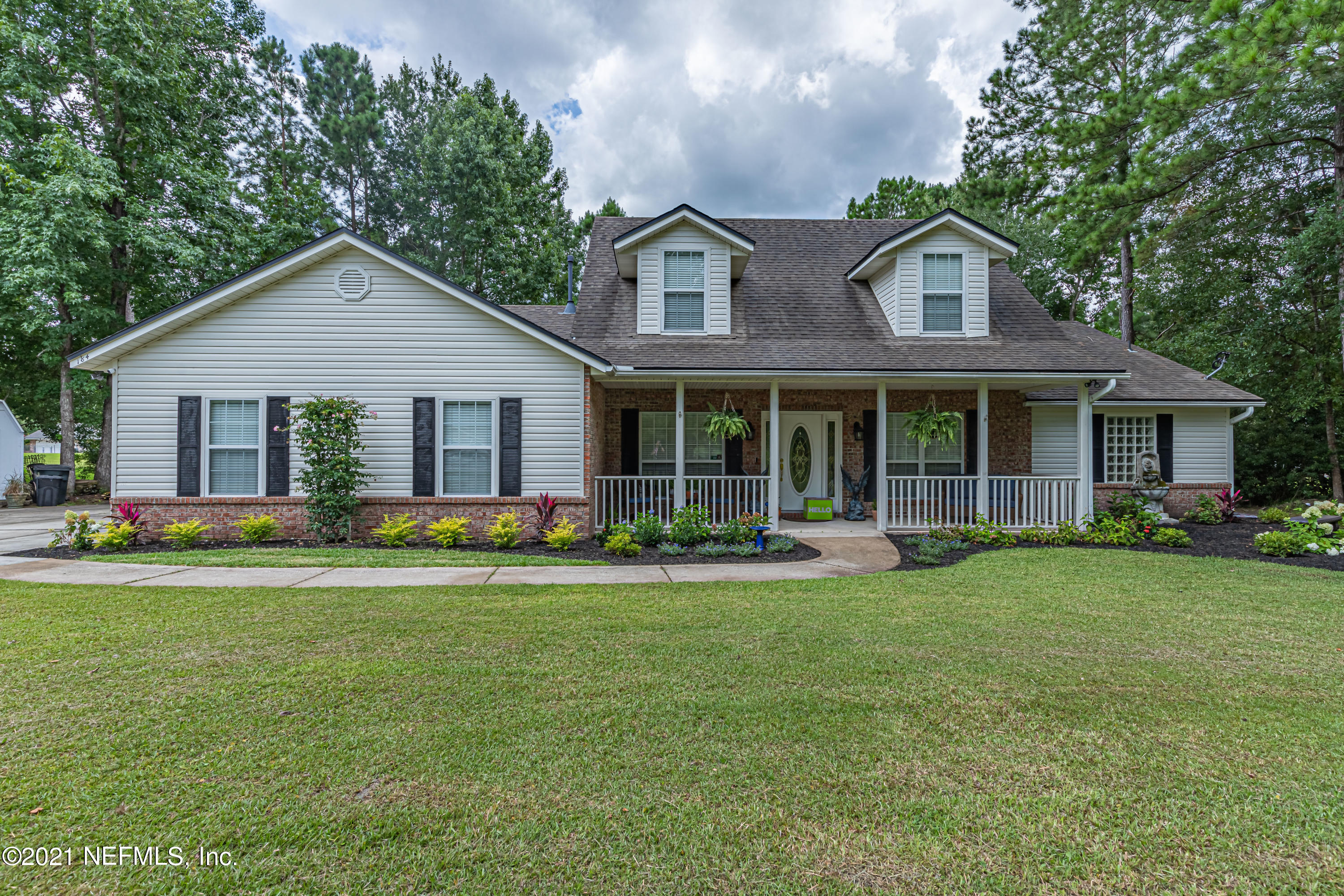 184 Circuit Rider Road Green Cove Springs, FL 32043 - Photo 2 of 58 a front view of a house with a yard and porch