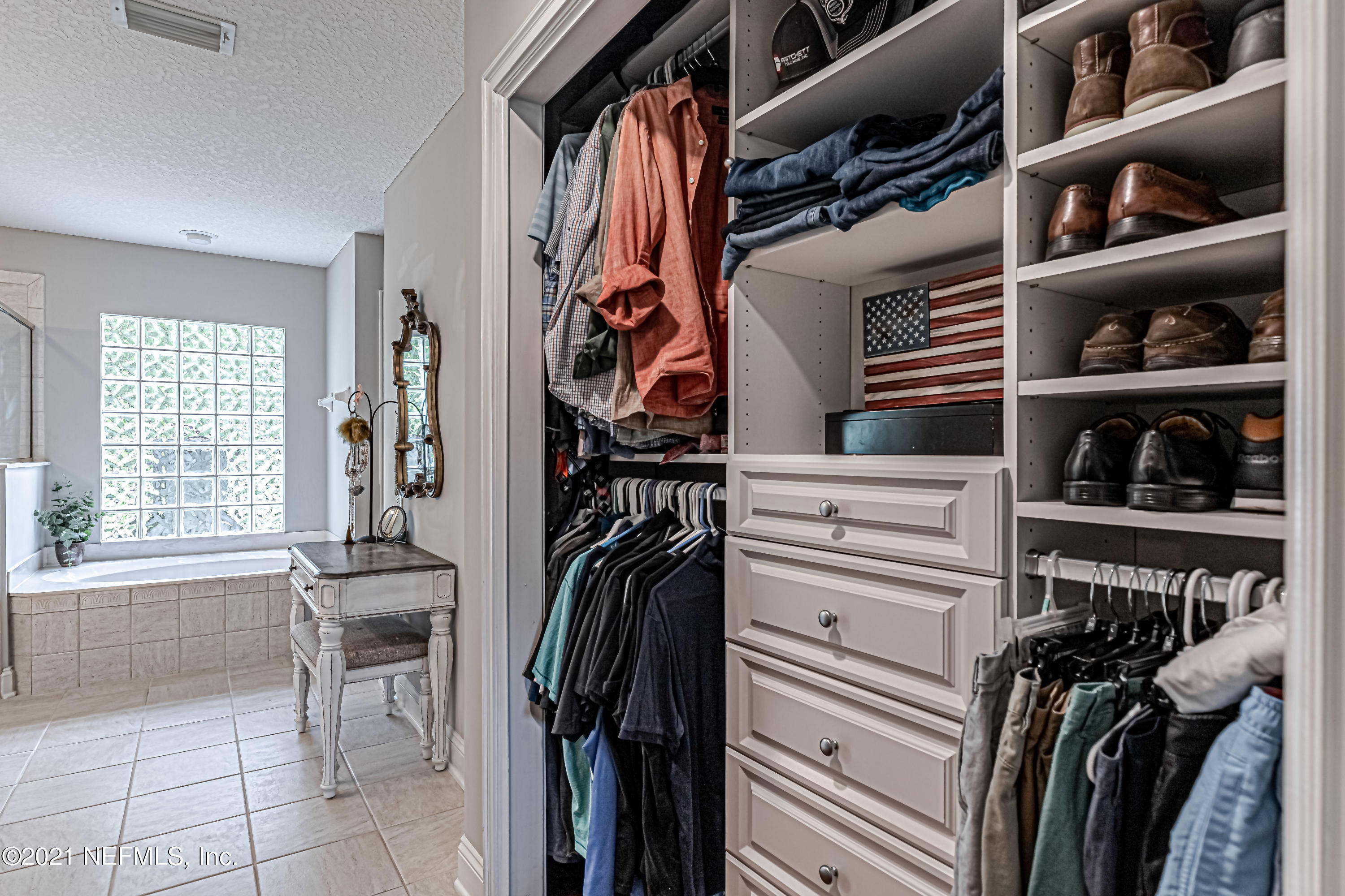 184 Circuit Rider Road Green Cove Springs, FL 32043 - Photo 30 of 58 a view of walk in closet with clothes and shoes