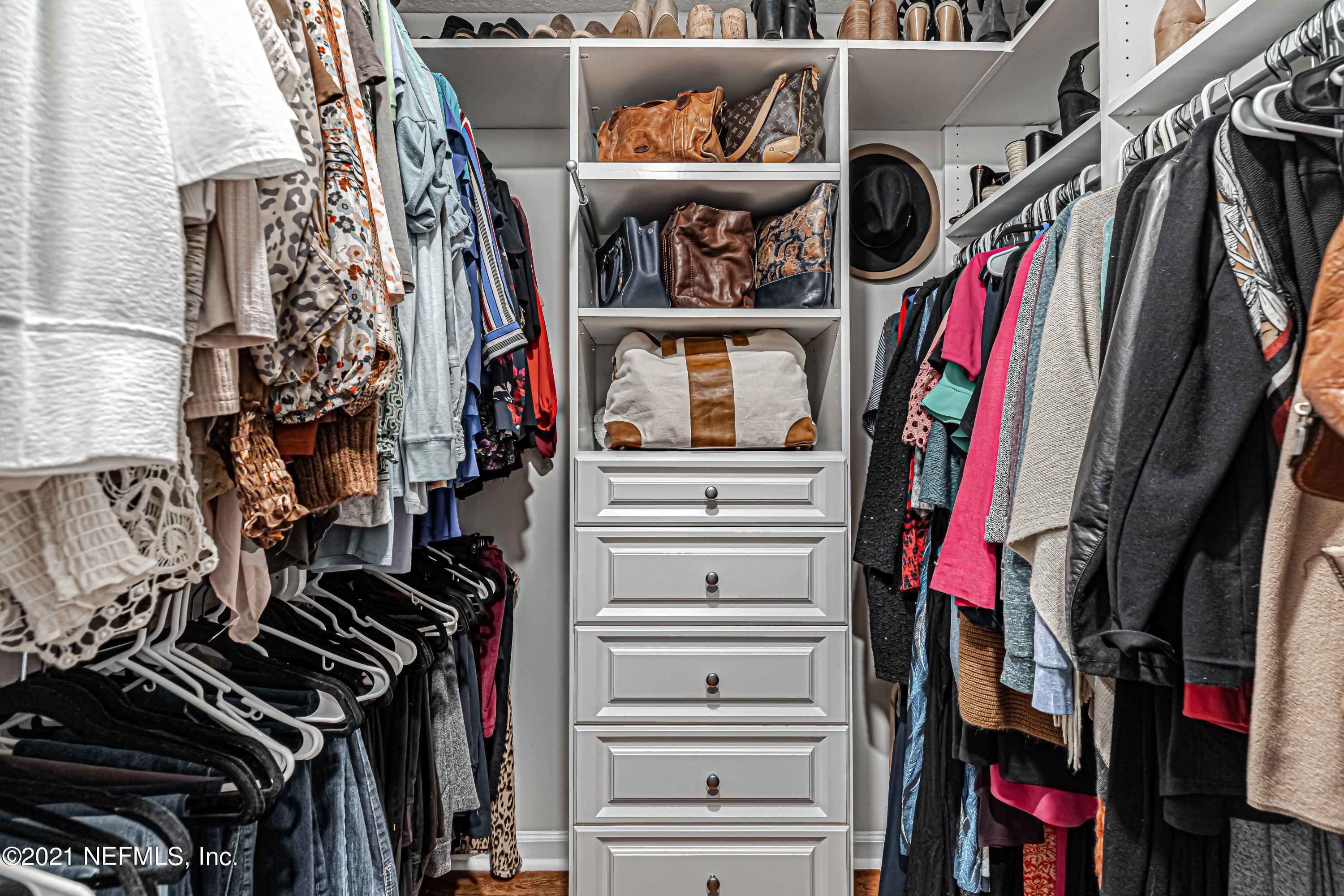 184 Circuit Rider Road Green Cove Springs, FL 32043 - Photo 31 of 58 a view of walk in closet with clothes and shoes
