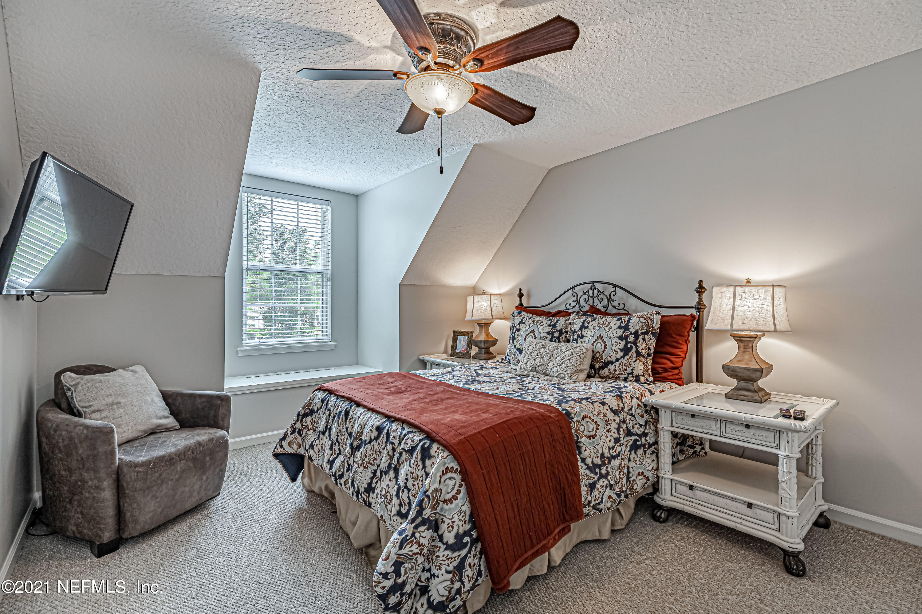 184 Circuit Rider Road Green Cove Springs, FL 32043 - Photo 39 of 58 a bedroom with a bed and a couch