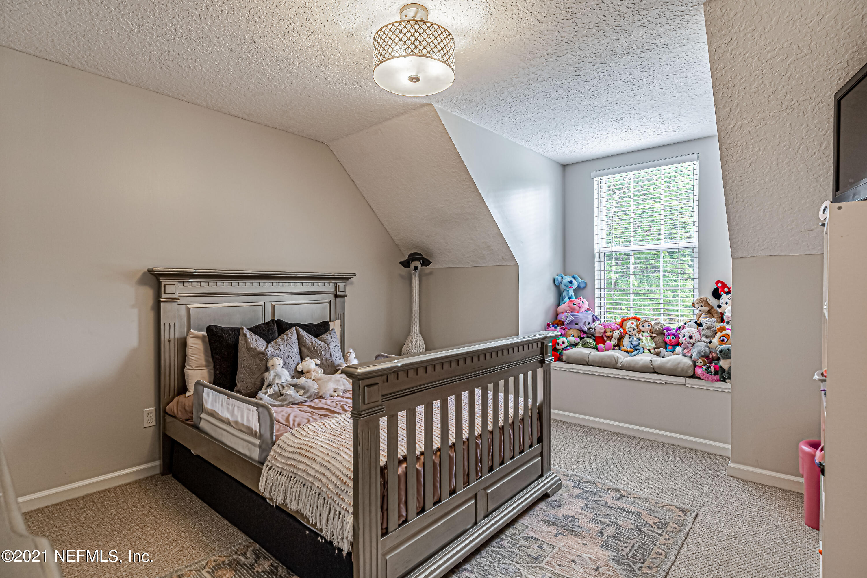 184 Circuit Rider Road Green Cove Springs, FL 32043 - Photo 42 of 58 a bedroom with a bed and a window