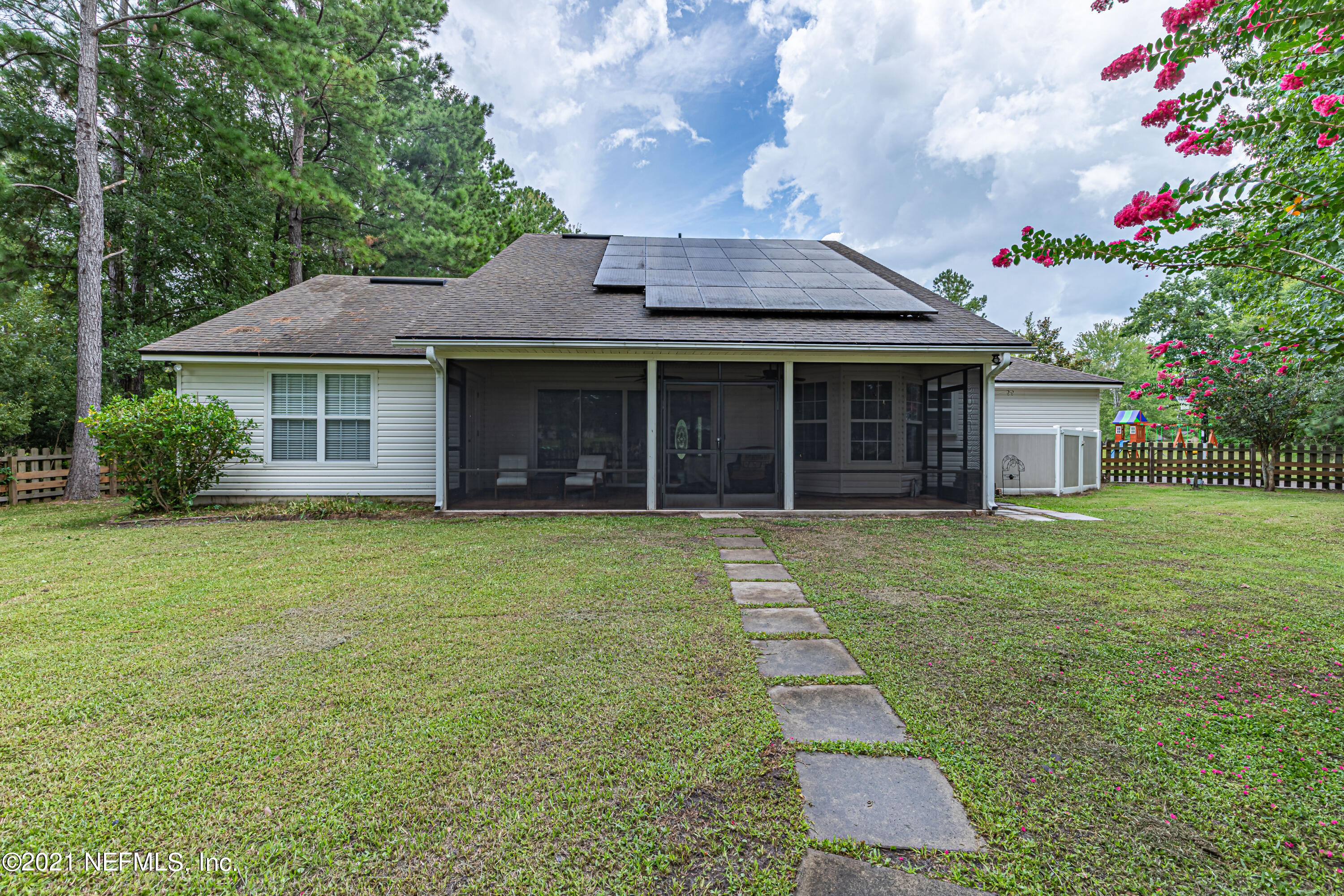184 Circuit Rider Road Green Cove Springs, FL 32043 - Photo 47 of 58 a front view of a house with a garden