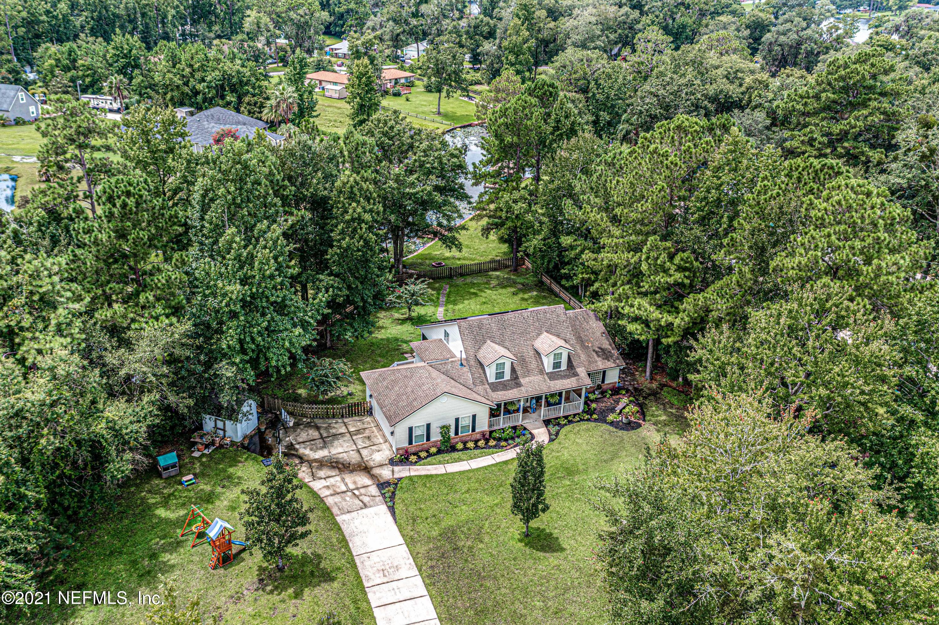 184 Circuit Rider Road Green Cove Springs, FL 32043 - Photo 52 of 58 an aerial view of a house with garden space and street view