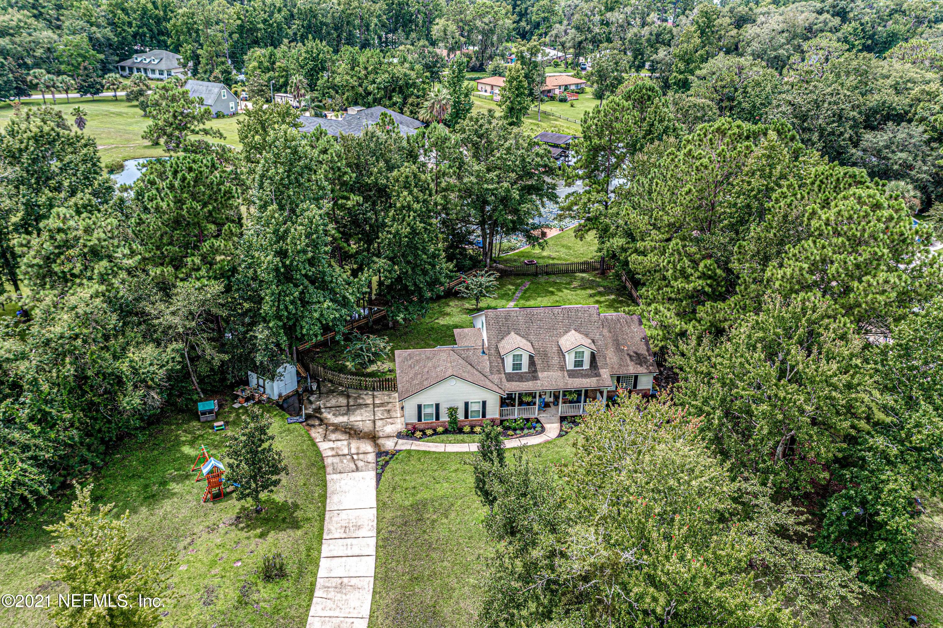 184 Circuit Rider Road Green Cove Springs, FL 32043 - Photo 53 of 58 an aerial view of a house with a garden