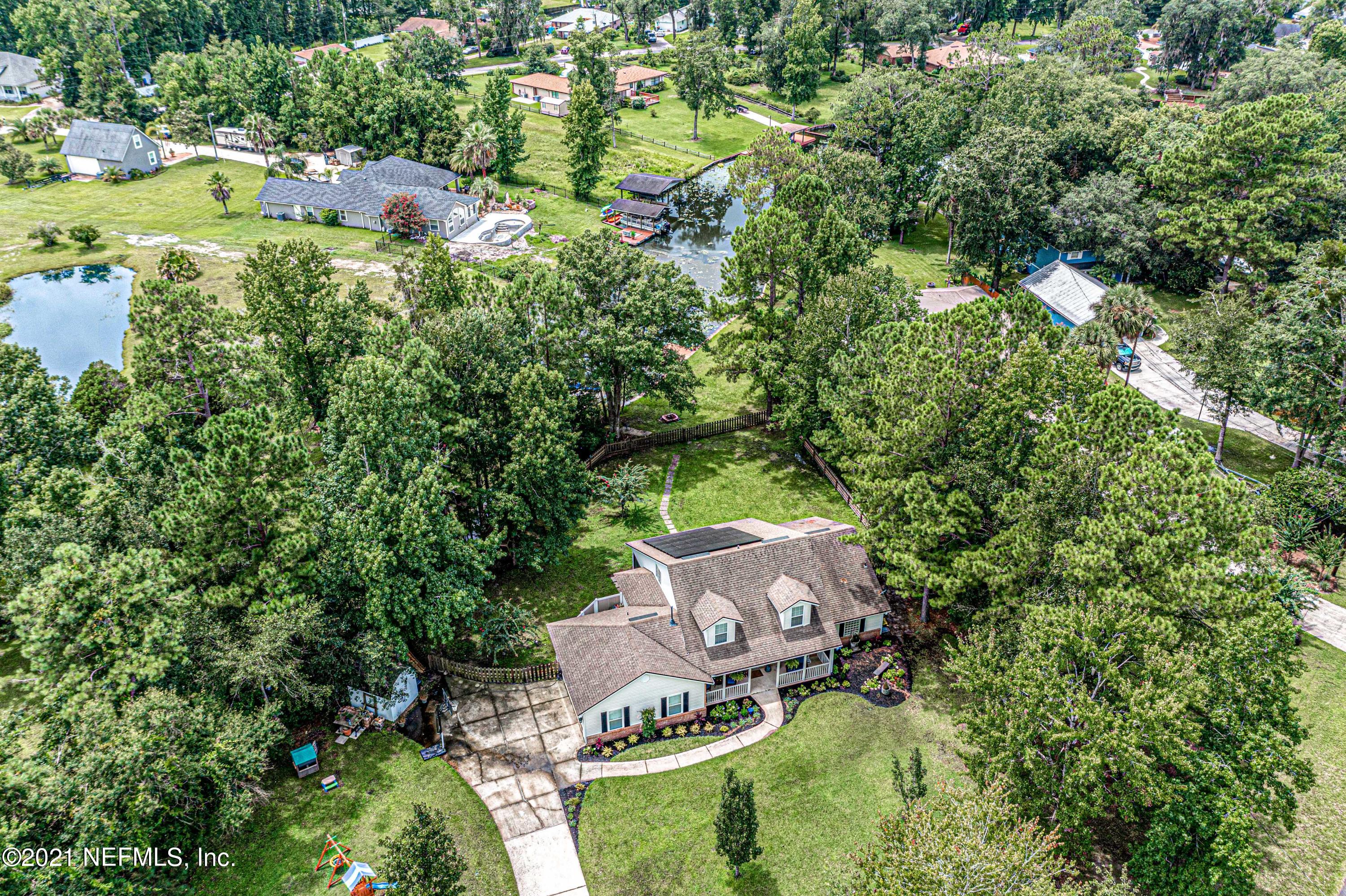 184 Circuit Rider Road Green Cove Springs, FL 32043 - Photo 54 of 58 an aerial view of residential house with outdoor space and trees all around