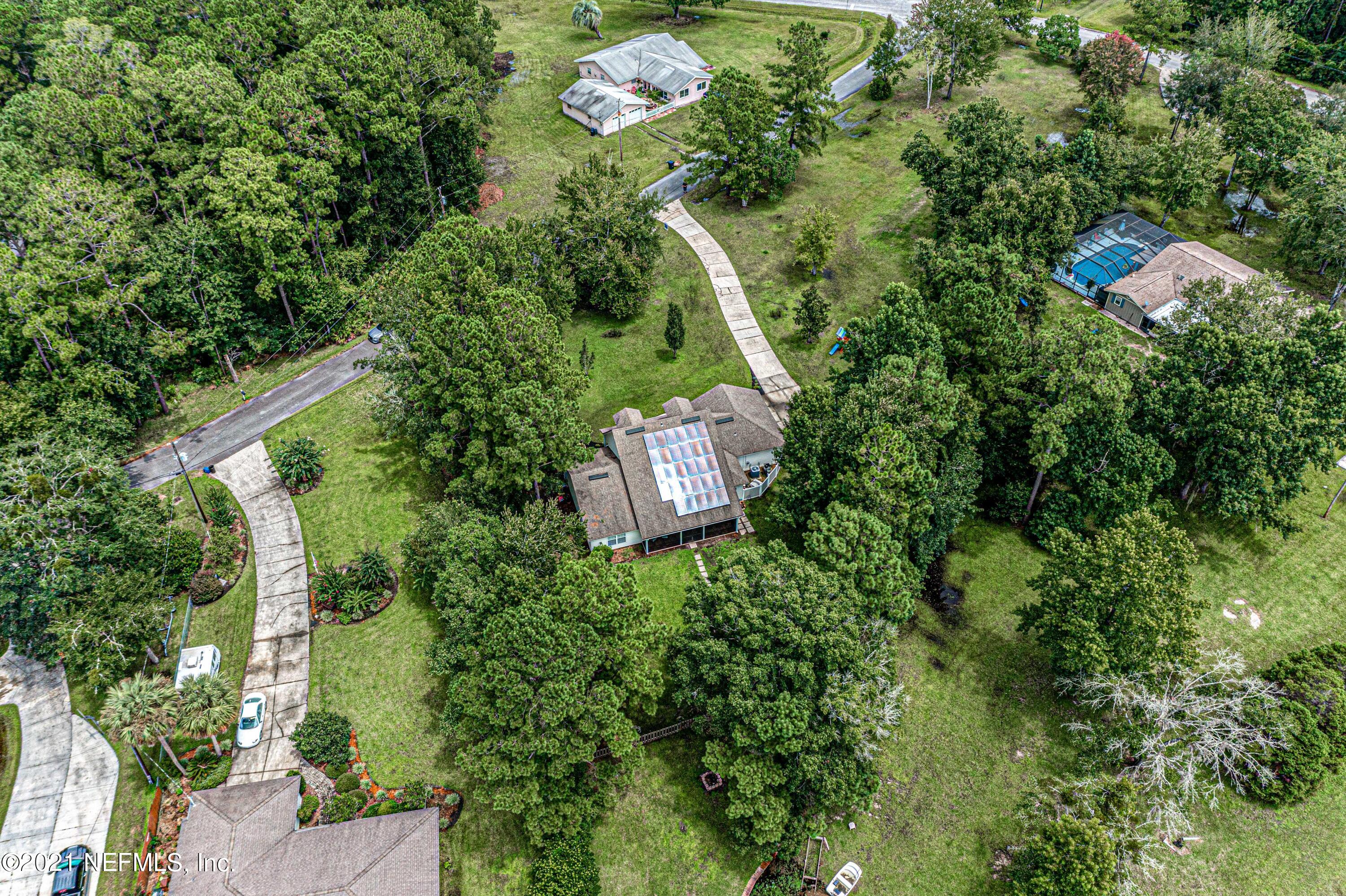 184 Circuit Rider Road Green Cove Springs, FL 32043 - Photo 55 of 58 an aerial view of a house with a yard