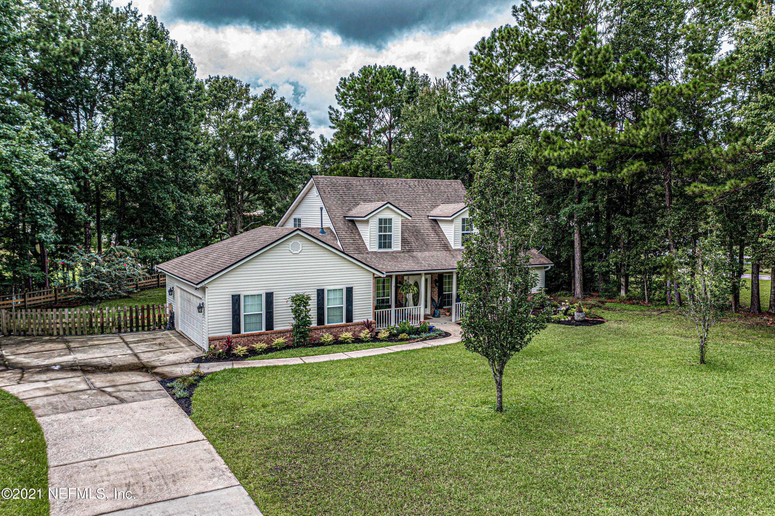 184 Circuit Rider Road Green Cove Springs, FL 32043 - Photo 6 of 58 a front view of a house with garden