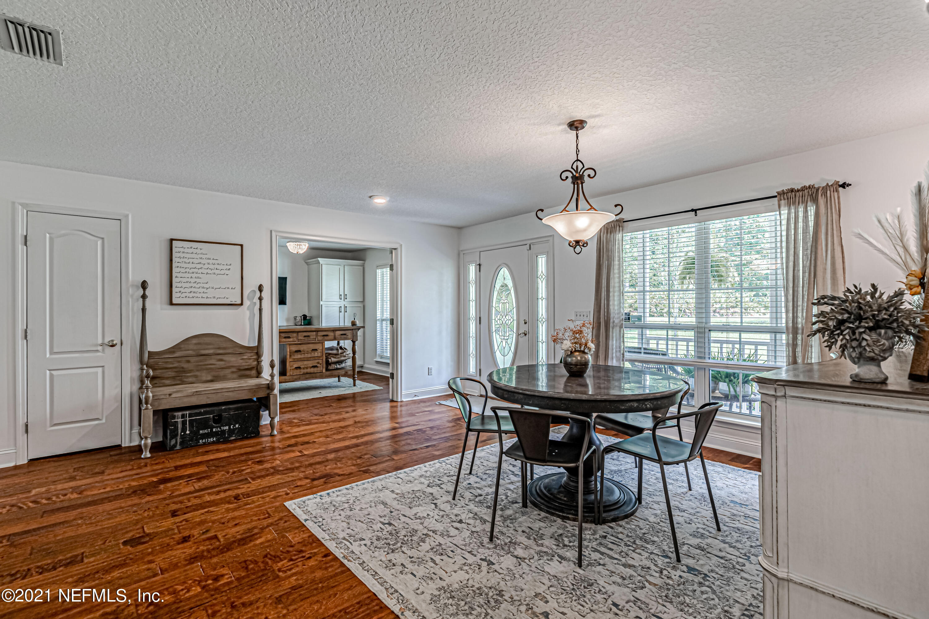 184 Circuit Rider Road Green Cove Springs, FL 32043 - Photo 9 of 58 a view of a dining room with furniture window and wooden floor