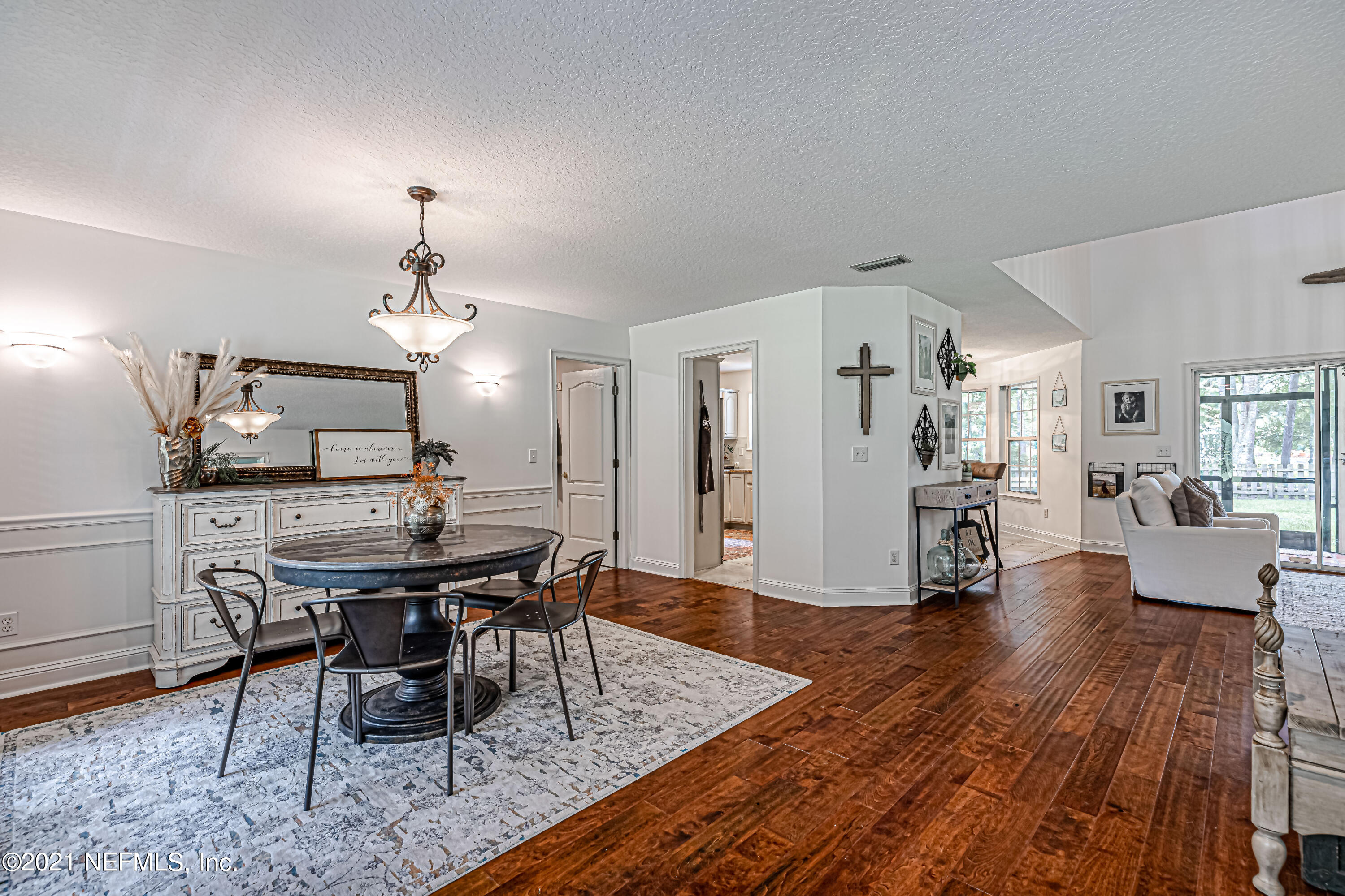 184 Circuit Rider Road Green Cove Springs, FL 32043 - Photo 10 of 58 a view of a dining room with furniture and wooden floor