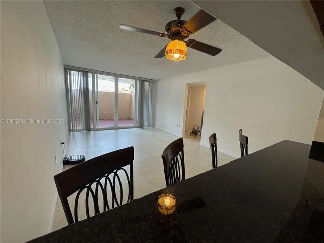 a view of livingroom and dining room with furniture