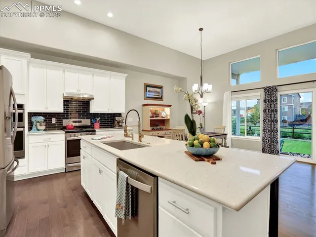 a kitchen with a sink stove and microwave