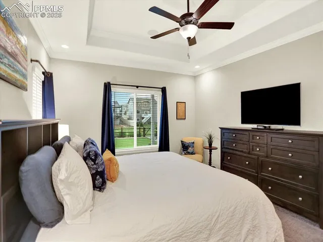 a bedroom with a large bed and a large window