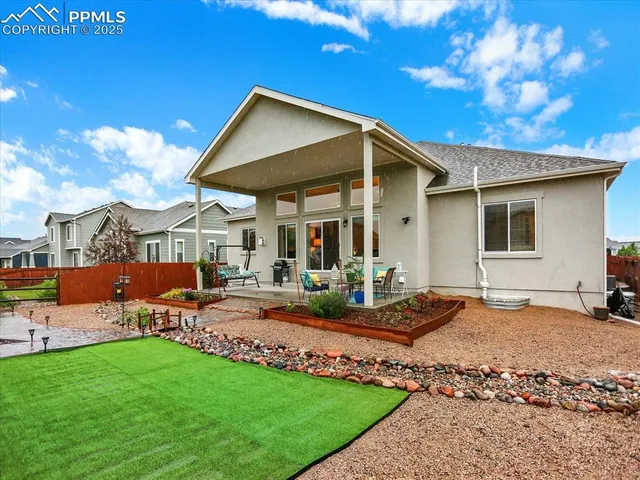 a patio with table and chairs