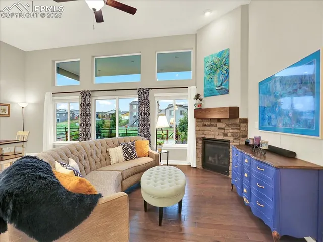 a living room with furniture fireplace and flat screen tv