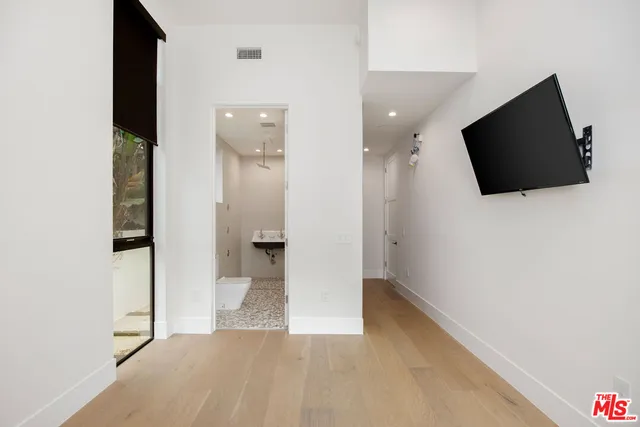 a view of a livingroom with a flat screen tv