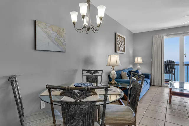 a living room with furniture a table and chairs