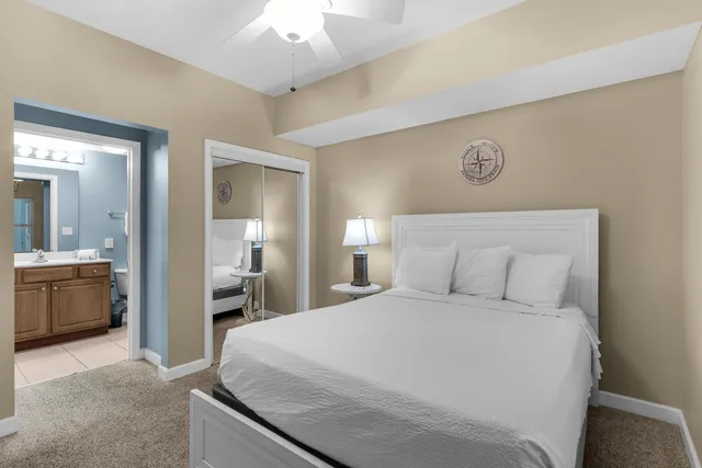 a large white bed in a white room