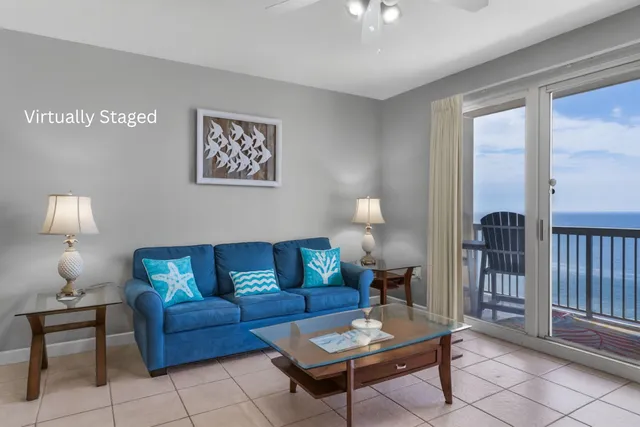 a living room with furniture a lamp and a window