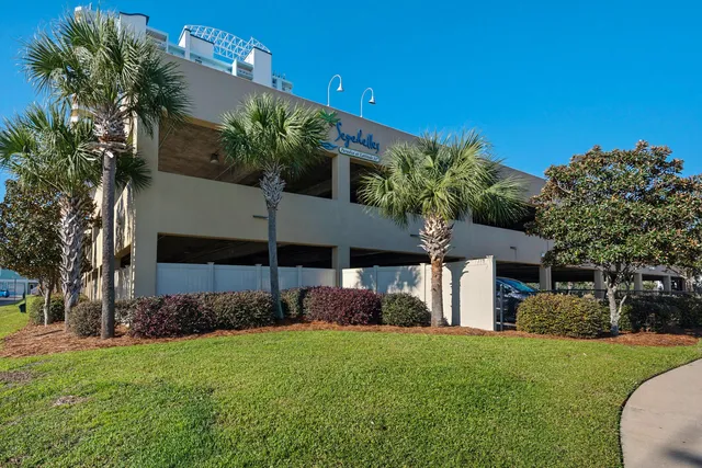 a front view of a house with a yard and outdoor seating