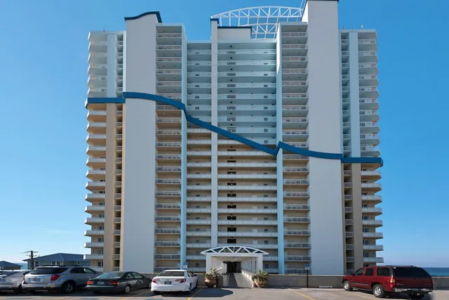 a room with gym equipment and a flat screen tv