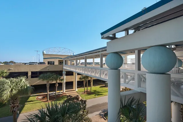 a view of a swimming pool with chairs