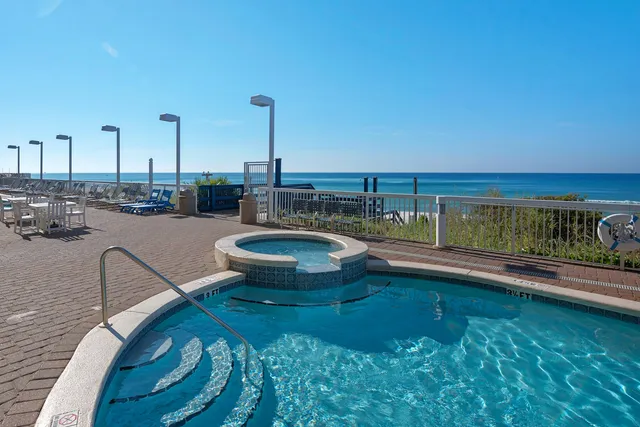 view of a swimming pool with an outdoor seating