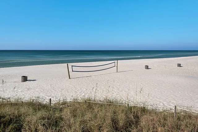 a living room with furniture and a lamp