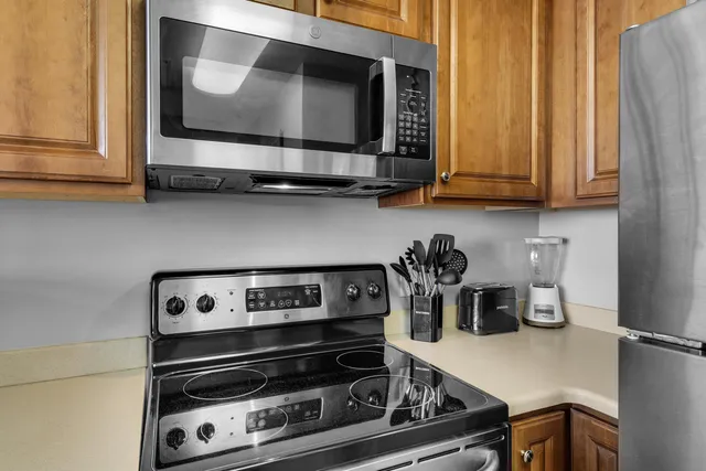 a kitchen with a stove and a microwave