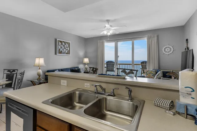 a kitchen with a sink and a refrigerator